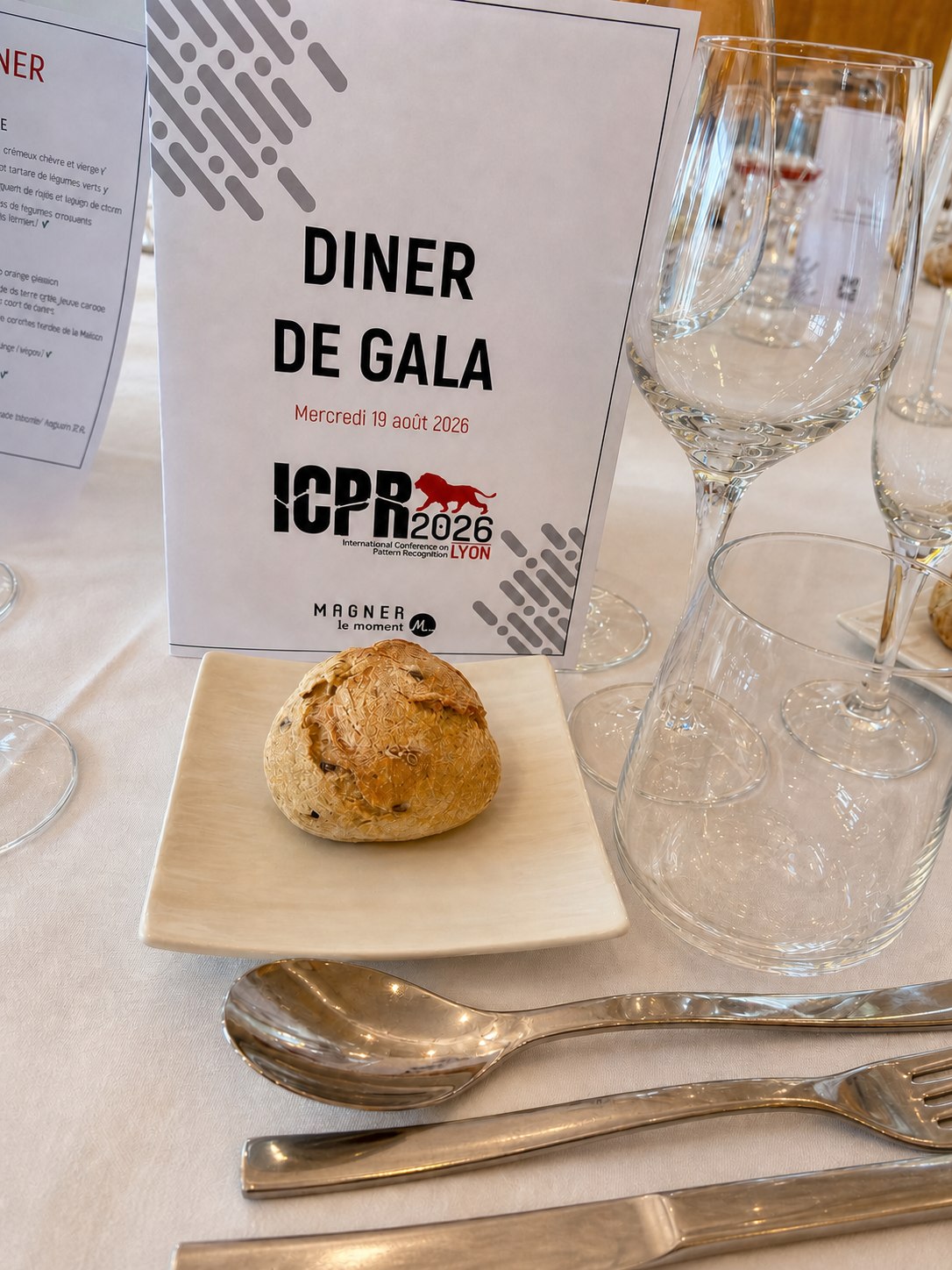 ICPR 2026 gala dinner menu displayed beside bread, glassware, and cutlery